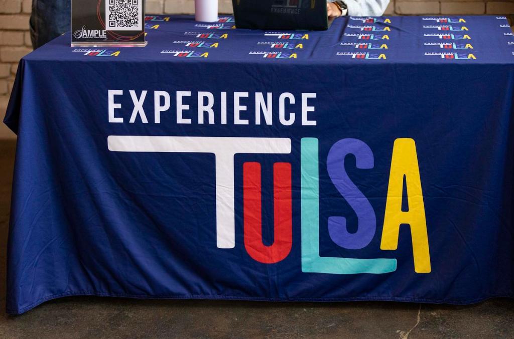 Experience Tulsa, which oversees Tulsa Remote, tables at The Canopy during an April 2, 2026, First Friday event.
