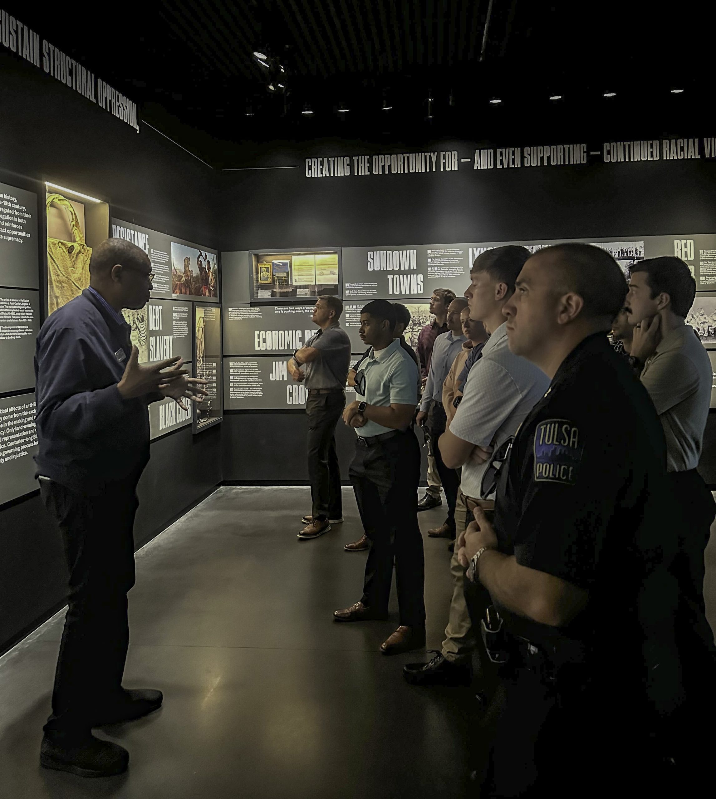 Raymond Doswell, executive director of Greenwood Rising, summarizes the history of racial violence in America to a cohort of Tulsa Police Department officers and prospective officers on October 10, 2025. The Tulsa Opera House, photographed on October 14, 2025.