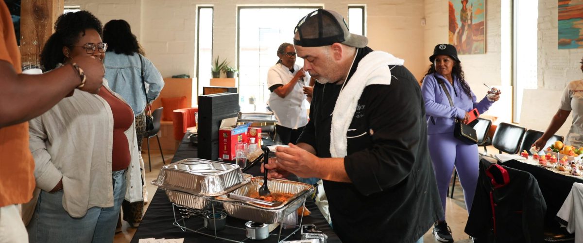 A chef serves up food at the State of Black Food Festival.