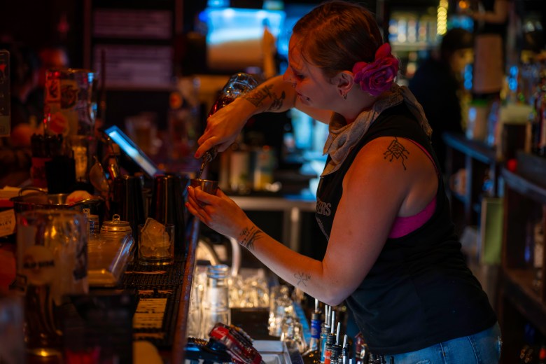 Ashley Olson, a bartender at The Starlite Bar in Midtown, serves clients Oct. 30, 2025.