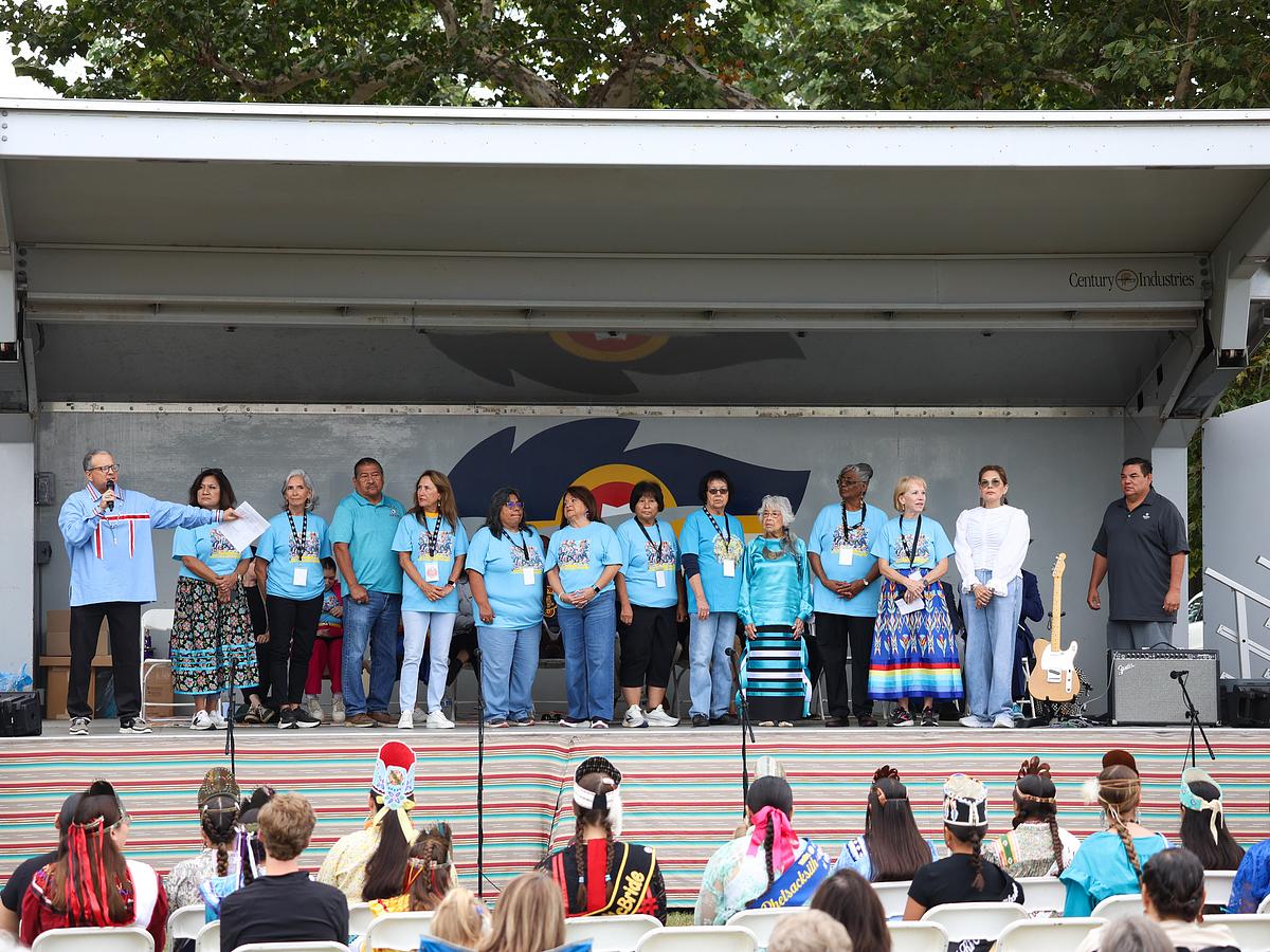 Members of the Greater Tulsa Area Indian Affairs Commission stand on stage during Tulsa Native American Day celebrations at Dream Keepers Park on Oct. 13, 2025.