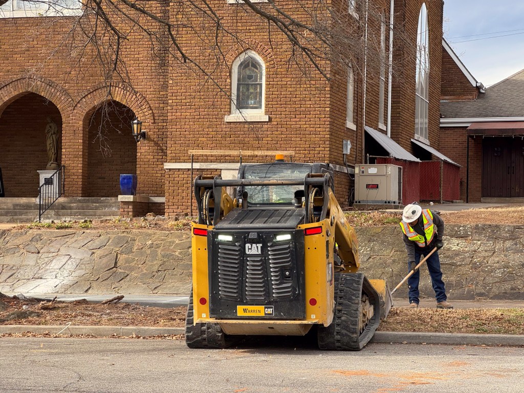 Construction crews outside a church