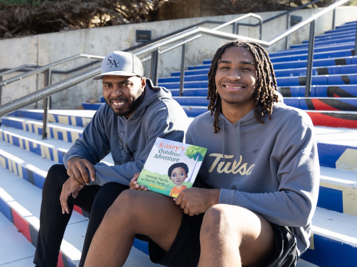 Kentrell Martin and his son KJ Martin Jr. with their newest book