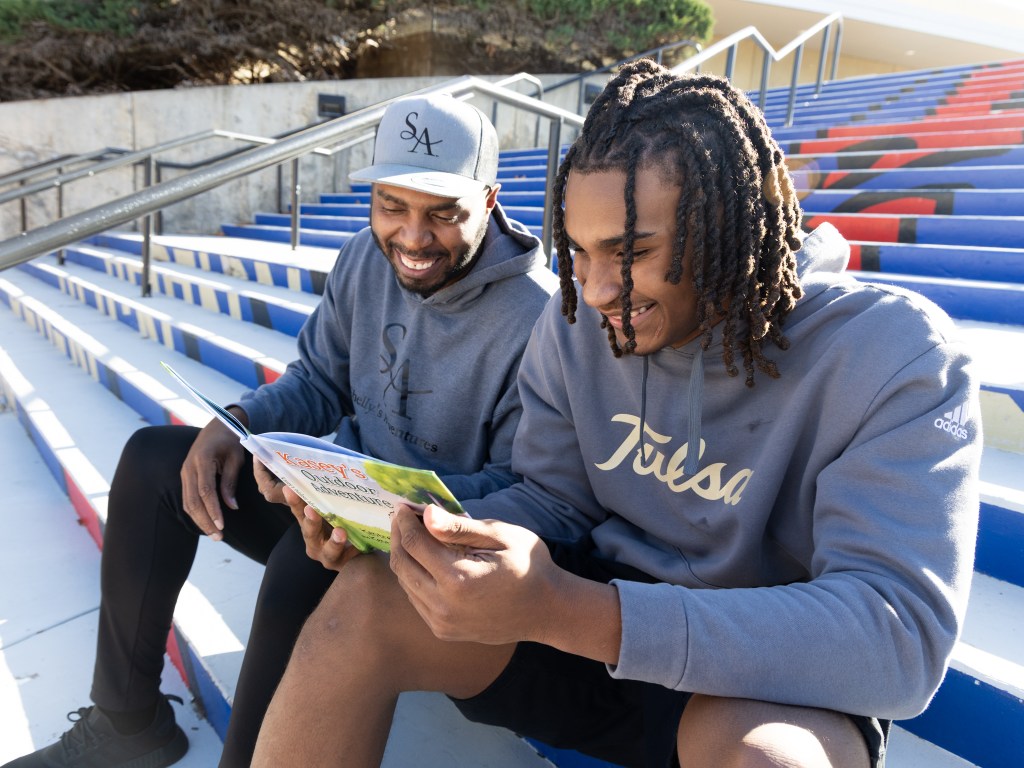 Kentrell Martin and his son KJ Martin Jr. with their newest book