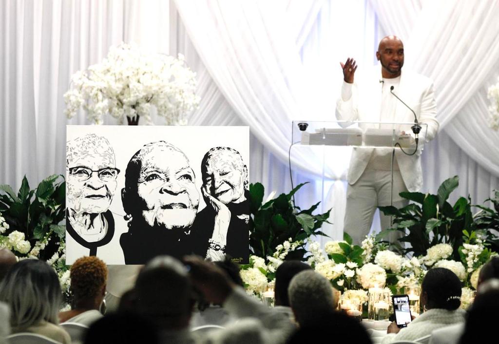 A portrait of Mother Viola Fletcher, donated to the Fletcher family by attorney Damario Solomon-Simmons, stands on the stage while Solomon-Simmons speaks during a celebration of life event on Nov. 29, 2025, at the Greenwood Cultural Center in Tulsa.