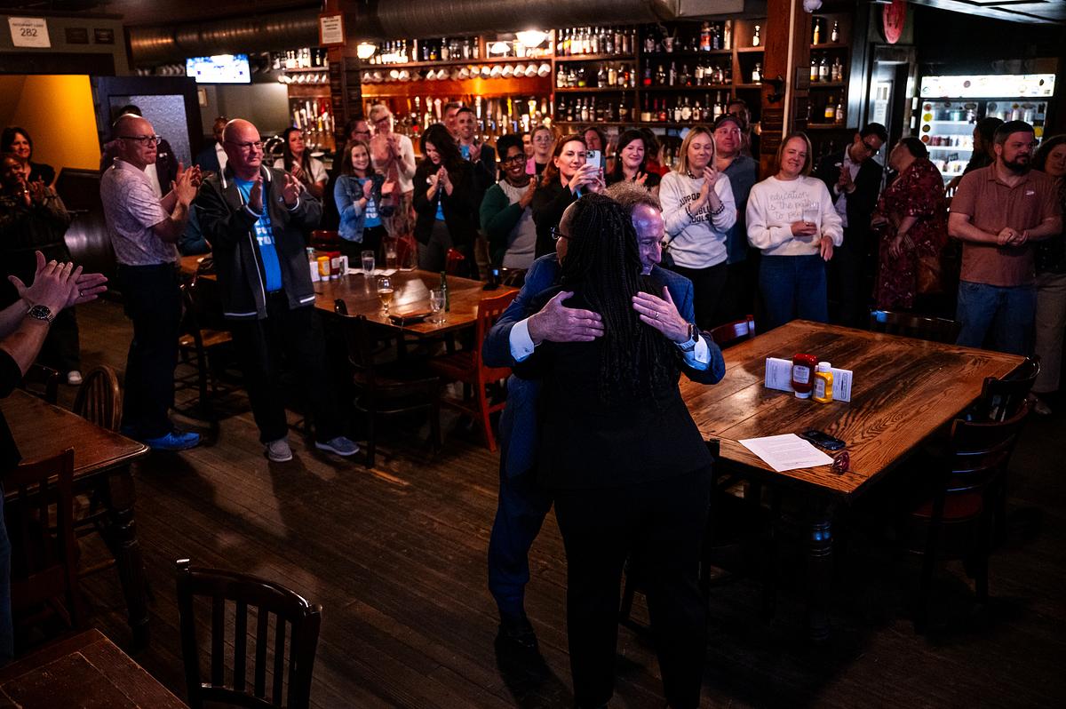Mike Neal, president of the Tulsa Regional Chamber, left, hugs Ebony Johnson, Tulsa Public Schools Superintendent, after the announcement that the Tulsa Public Schools bond package passed during an election night watch party at McNellie's April 7, 2026.
