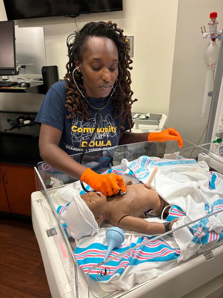 Ebony Jones trains for her doula certification. 
