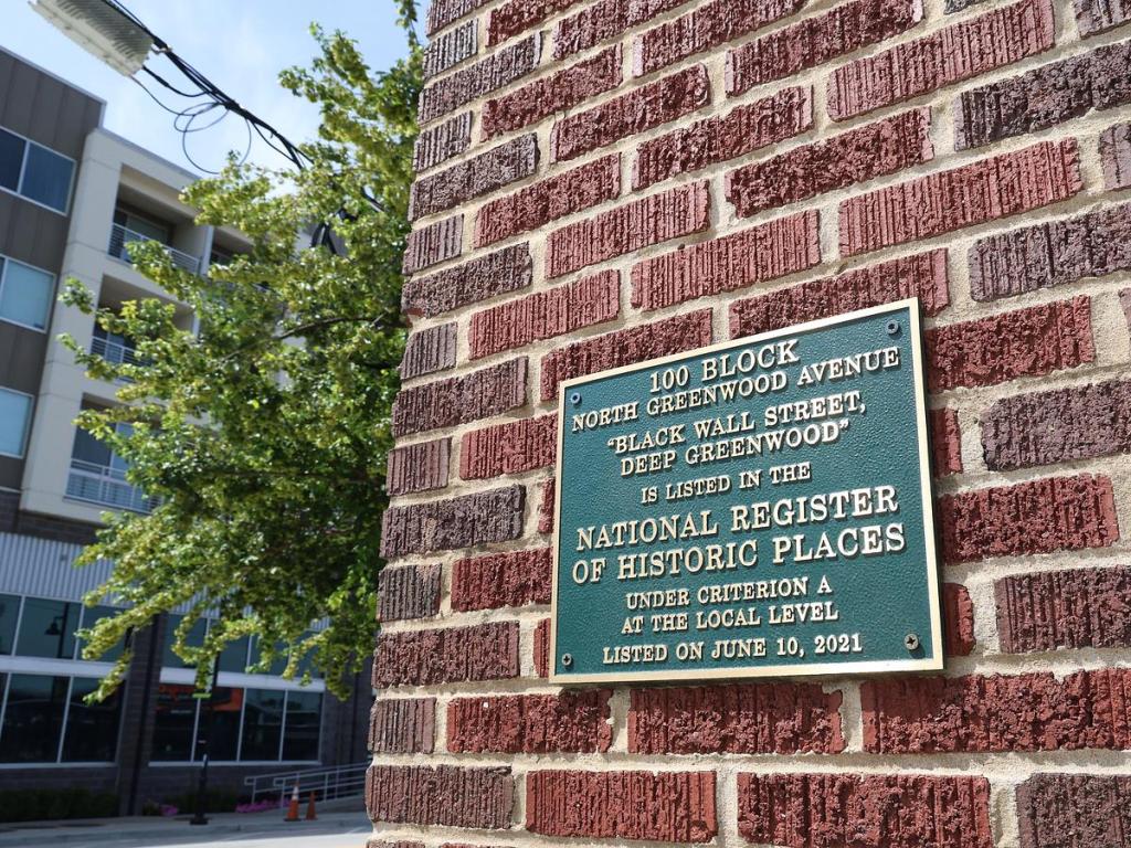 A marker for the Historic Greenwood District sits in downtown July 23, 2025.