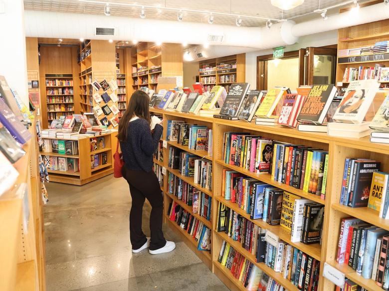 Shopping at Magic City Books, 221 E. Archer St., on Dec. 16, 2025.