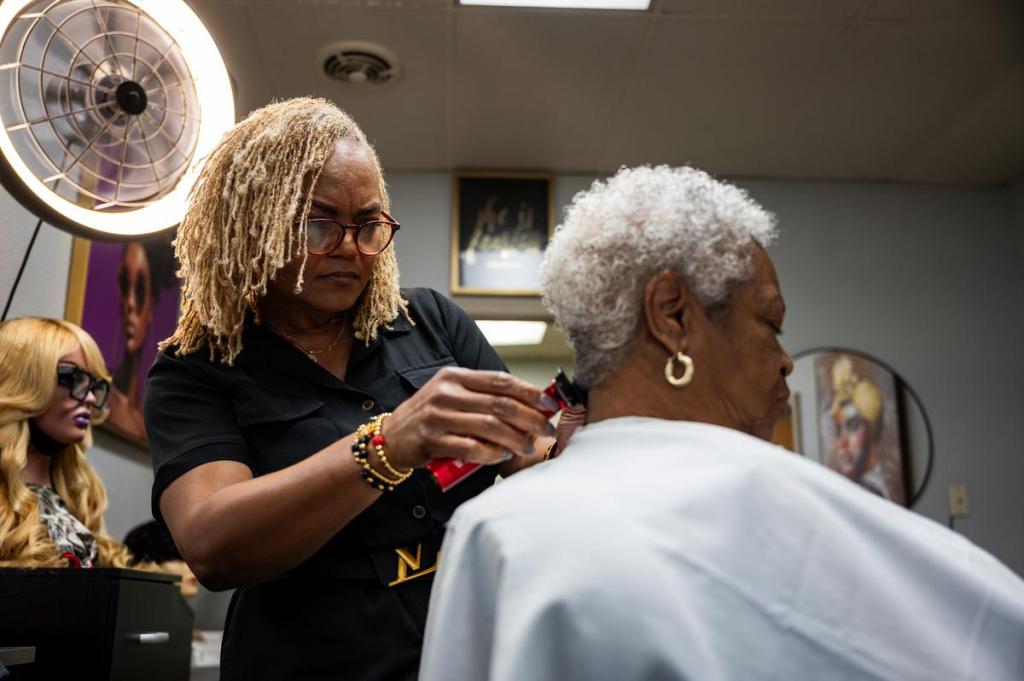 Tonya Johnson cuts her mom Lavern Doyle's hair at Nu Xpressions on Tuesday, May 21, 2026. Johnson has been doing hair for nearly 30 years. 