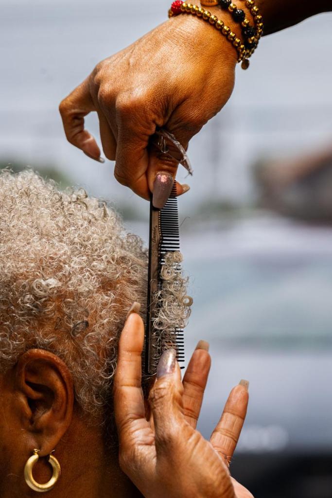 Tonya Johnson cuts her mom Lavern Doyle's hair at Nu Xpressions on Tuesday, May 21, 2026. Johnson has been doing hair for nearly 30 years. 