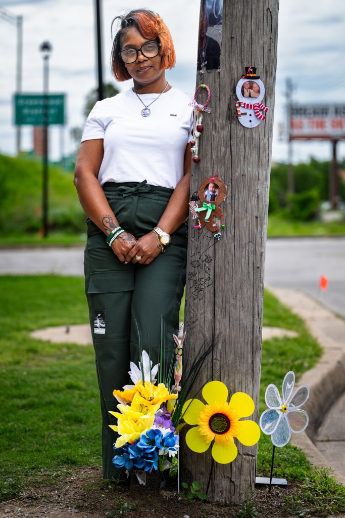 Angel Spears poses for a portrait next to her son Isaiah Knight’s memorial in Greenwood on Wednesday, April 29, 2026. Knight, 22, was shot and killed at the 2025 Juneteenth festival in downtown Tulsa.