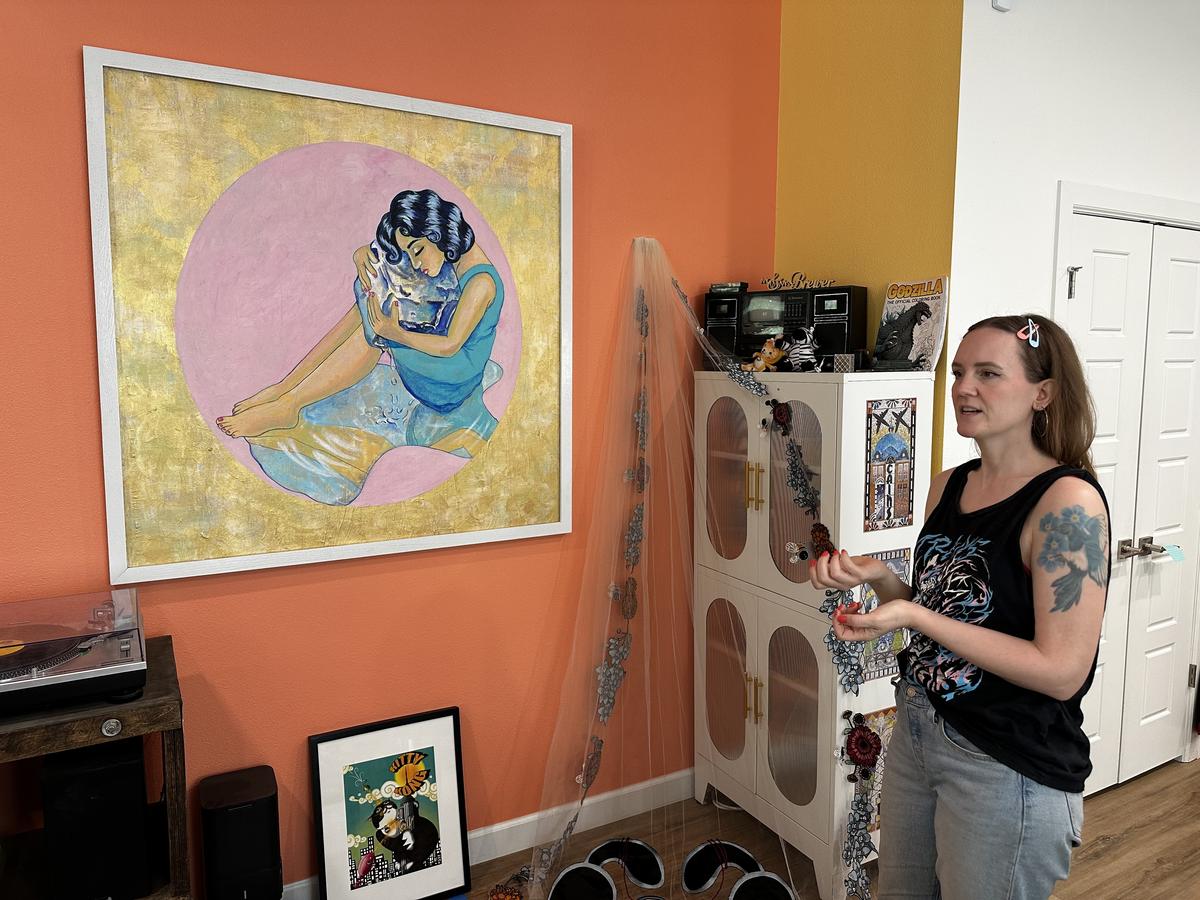 Shayna Brewer stands inside her north Tulsa home and describes her work during the Hidden Creatives tour on May 24, 2026.