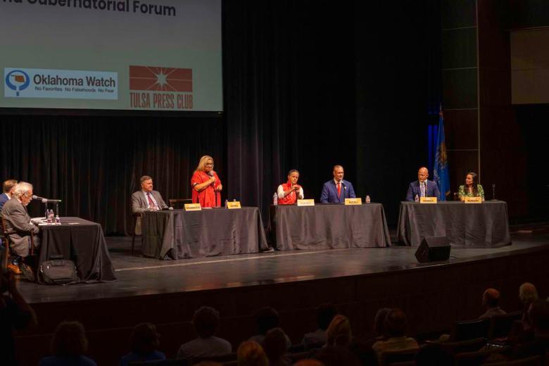 From left to right: Gubernatorial candidates Gentner Drummond, Leisa Mitchell Haynes, Chip Keating, Charles McCall, Chip Merrick and Cyndi Munson appear on stage at a question-and-answer session hosted by the Tulsa Press Club at the University of Tulsa June 2, 2026.