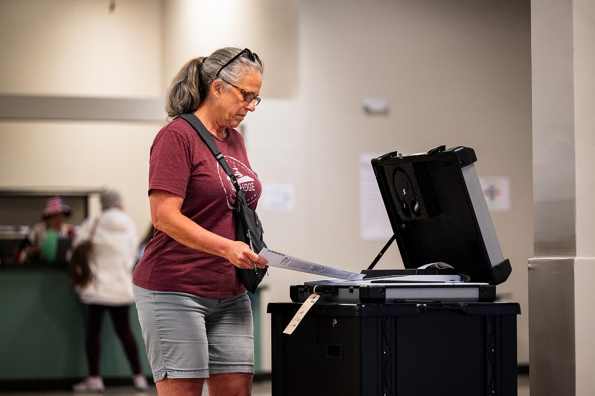 A voter submits their ballot during the early voting period at the Tulsa County Election Board office Wednesday, April 2, 2026.