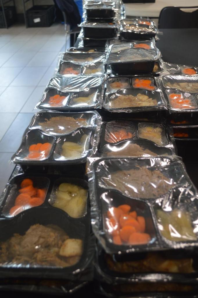 Stored Goodness Community Market's offerings on June 26, 2026, included ready to eat plates of pot roast, potatoes, carrots and warm pears.
