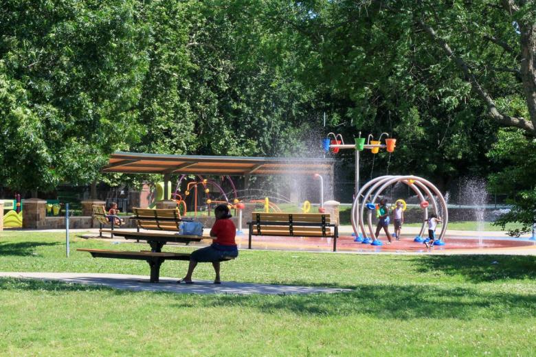A family beats the heat in the splash pad at at the Lacy Park on Wednesday June 17, 2026.