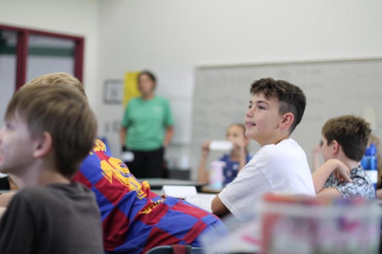 Tulsa Public Schools student Anthony D'alonzo listens to Tulsa SPCA's animal safety presentation at Kendall-Whittier Elementary on Tuesday, July 7, 2026. After attending academic classes from 8:25 a.m. to 1 p.m., D'alonzo and other summer students attend afternoon programs led by community organizations.
