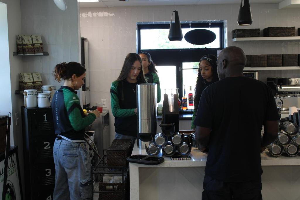Guy Troupe instructs employees at Black Wall Street Liquid Lounge on July 21, 2026. The business relocated from Black Wall Street to The Greenwood Entrepreneurship at Moton. 
