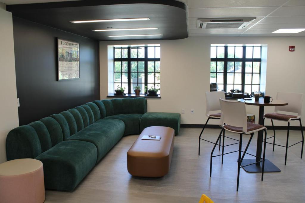 Black Wall Street Liquid Lounge on July 21, 2026. The area features a green couch. 
