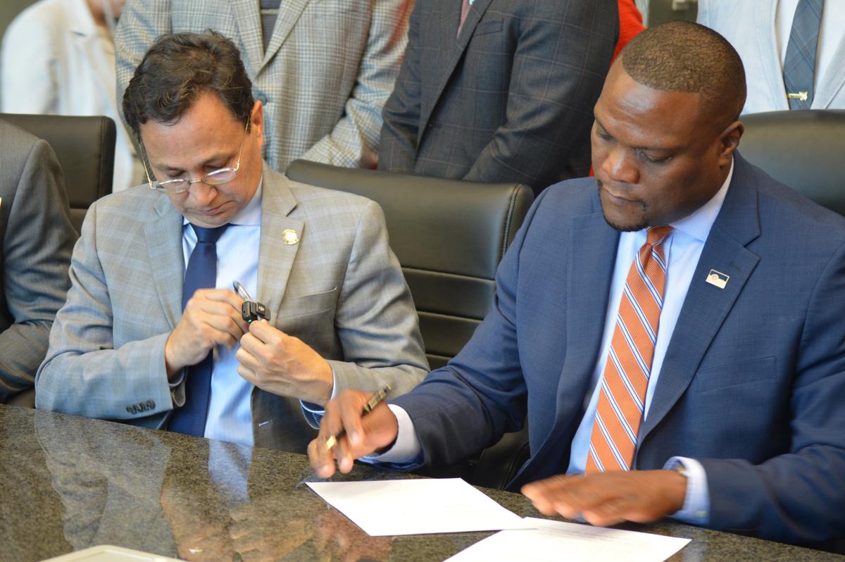 Cherokee Nation Chief Chuck Hoskin Jr. and Mayor Monroe Nichols sign a healthcare agreement on Wednesday, July 15, 2026.